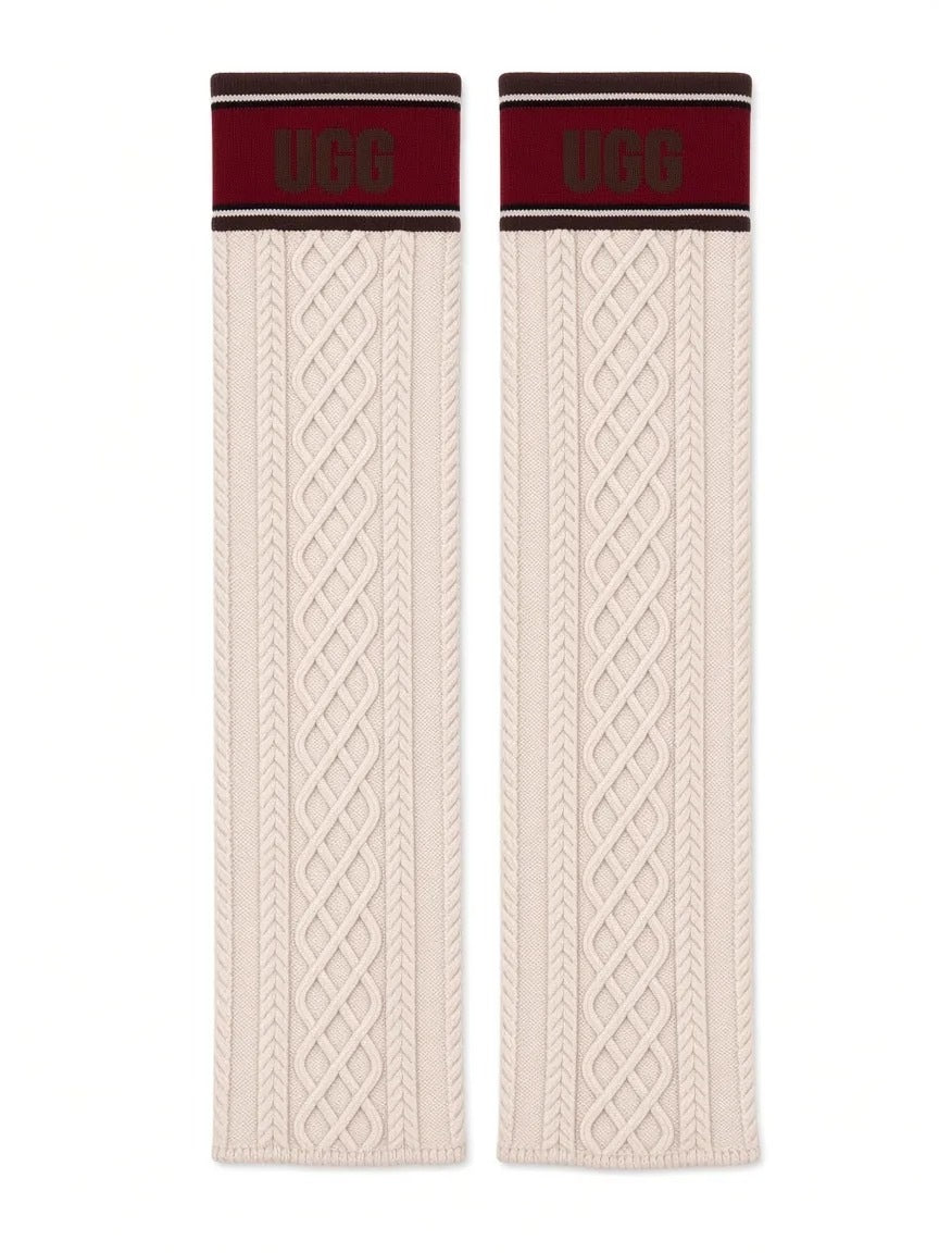 UGG knit socks laid flat, cream cable knit with maroon UGG cuff