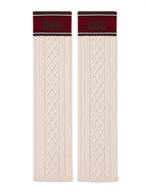 UGG knit socks laid flat, cream cable knit with maroon UGG cuff